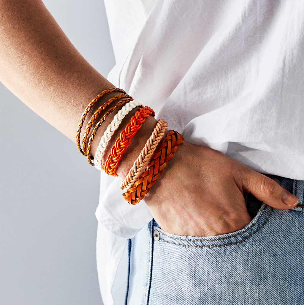person-wearing-multiple-braided-leather-bracelets-CEMPMQ0CaOyB2xeE1ZY8N9-0621